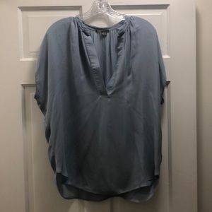 Vince. Light blue silk top. Short flutter sleeve. V-neck. Longer in back.